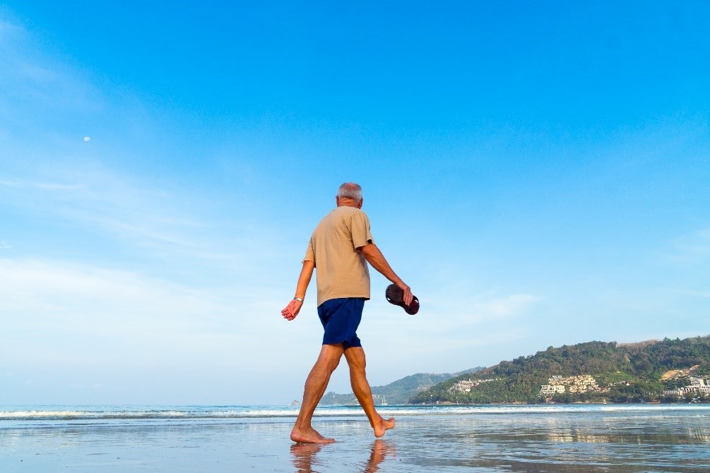 Older Gentlemen Walking on Beach