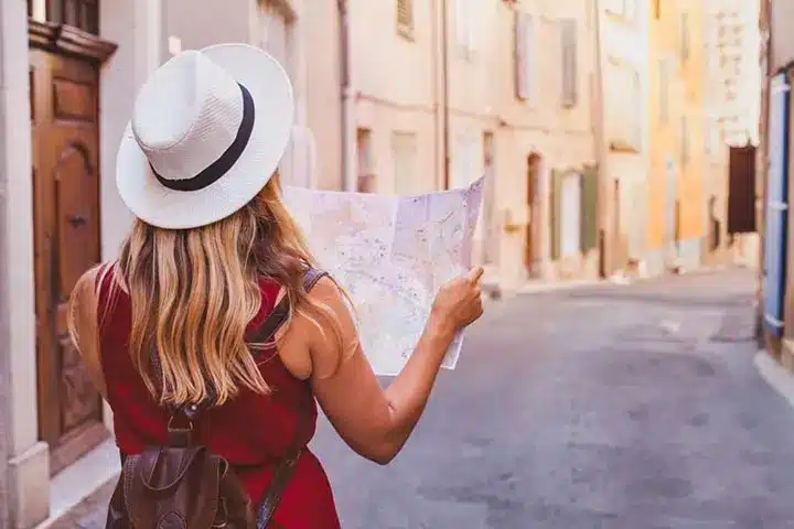 Lady with Map in European Town - Look for Opportunity during Volatile Investment Market