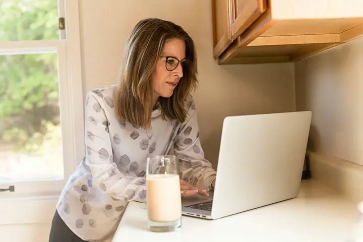 Lady working on her laptop - Impact of Coronavirus on Financial Planning
