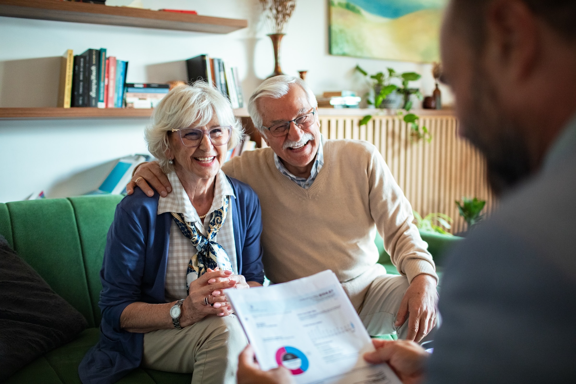 senior couple engaging with wealth advisor for charitable planning