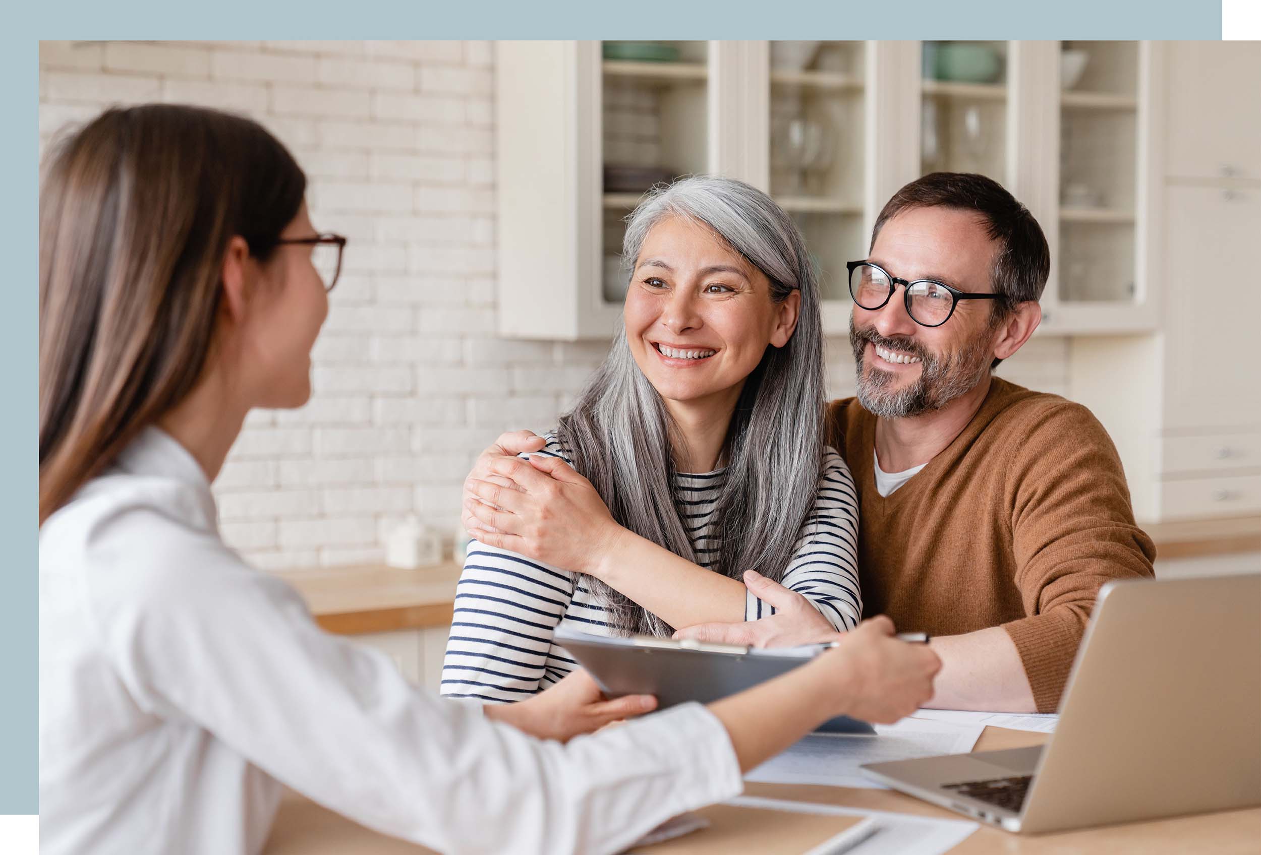 Young couple shaking hands with a donor or business owner